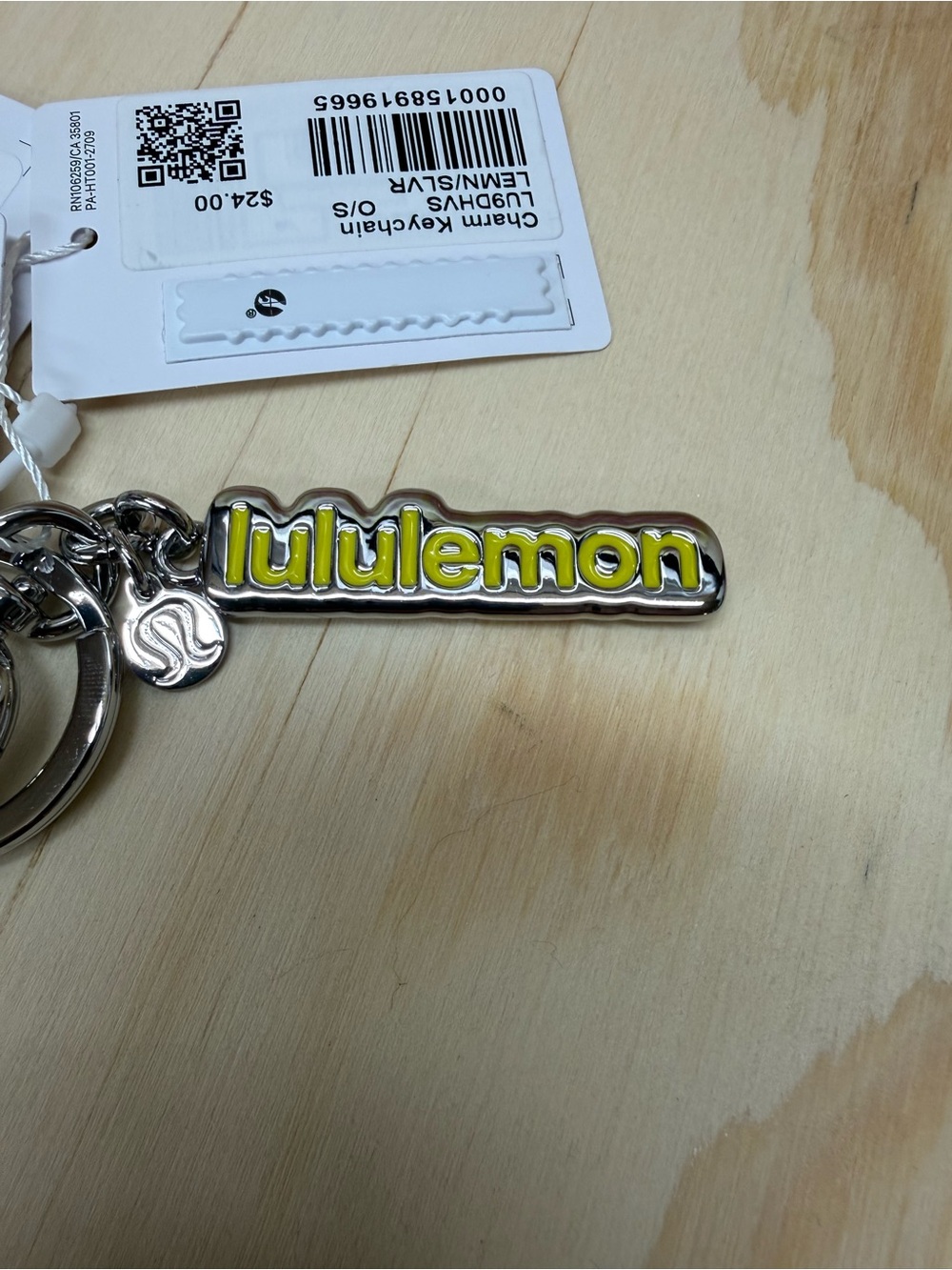 lululemon Silver Keychain with Yellow Logo Accent